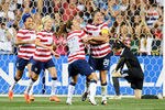 CHESTER, PA - MAY 27: Sydney Leroux #11, Megan Rapinoe #15 and Lauren Cheyney #12 of the USA congratulate teammate Abby Wambach #20 on a second half goal in front of Zhang Yue #1 of the China at PPL Park on May 27, 2012 in Chester, Pennsylvania. USA won 4-1. (Photo by Drew Hallowell/Getty Images)