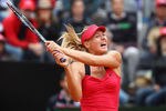 ROME, ITALY - MAY 20:  Maria Sharapova of Russia plays a backhand against Na Li of China during their final match during day nine of the Internazionali BNL d'Italia 2012 at the Foro Italico Tennis Centre on May 20, 2012 in Rome, Italy.  (Photo by Julian Finney/Getty Images)