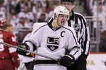 GLENDALE, AZ - MAY 22:  Dustin Brown #23 of the Los Angeles Kings reacts alongside a referee after Brown checked Michal Rozsival #32 of the Phoenix Coyotes in overtime of Game Five of the Western Conference Final during the 2012 NHL Stanley Cup Playoffs at Jobing.com Arena on May 22, 2012 in Phoenix, Arizona.  (Photo by Jeff Gross/Getty Images)