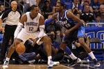ORLANDO, FL - MARCH 30:  Dwight Howard #12 of the Orlando Magic drives aganst Ian Mahinmi #28 of the Dallas Mavericks during the game at Amway Center on March 30, 2012 in Orlando, Florida.  NOTE TO USER: User expressly acknowledges and agrees that, by downloading and or using this photograph, User is consenting to the terms and conditions of the Getty Images License Agreement.  (Photo by Sam Greenwood/Getty Images)