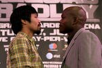 BEVERLY HILLS, CA - FEBRUARY 21:  Manny Pacquiao (L) and Timothy Bradley pose for photographers at a press conference announcing their upcoming World Boxing Organization welterweight championship fight at The Beverly Hills Hotel on February 21, 2012 in Beverly Hills, California.  (Photo by Stephen Dunn/Getty Images)