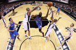 SAN ANTONIO, TX - MAY 27:  James Harden #13 of the Oklahoma City Thunder goes up for a shot between Tim Duncan #21 and Tony Parker #9 of the San Antonio Spurs in the first half in Game One of the Western Conference Finals of the 2012 NBA Playoffs at AT&T Center on May 27, 2012 in San Antonio, Texas. NOTE TO USER: User expressly acknowledges and agrees that, by downloading and or using this photograph, user is consenting to the terms and conditions of the Getty Images License Agreement.  (Photo by Ronald Martinez/Getty Images)