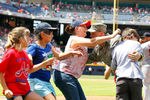 ATLANTA, GA - MAY 28:  Master Sergeant David Sims is reunited with his wife Robin and his family during the fifth inning of the Memorial Day celebration between the Atlanta Braves and the St. Louis Cardinals at Turner Field on May 28, 2012 in Atlanta, Georgia.  (Photo by Kevin C. Cox/Getty Images)