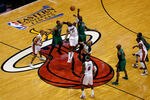 MIAMI, FL - MAY 28:  Kevin Garnett #5 of the Boston Celtics fights for control of the opening tip-off against Ronny Turiaf #21 of the Miami Heat in Game One of the Eastern Conference Finals in the 2012 NBA Playoffs on May 28, 2012 at American Airlines Arena in Miami, Florida.  NOTE TO USER: User expressly acknowledges and agrees that, by downloading and or using this photograph, User is consenting to the terms and conditions of the Getty Images License Agreement.  (Photo by J. Meric/Getty Images)