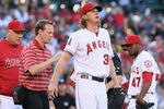 ANAHEIM, CA - MAY 28:  Starting pitcher Jered Weaver #36 of the Los Angeles Angels of Anaheim is attended to after injuring himself, as manager Mike Scioscia (L) and Howard Kendrick (R) #47 look on in the first inning against the New York Yankees at Angel Stadium of Anaheim on May 28, 2012 in Anaheim, California.  (Photo by Jeff Gross/Getty Images)