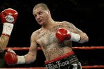 LAS VEGAS, NV - NOVEMBER 2:   Johnny Tapia defends himself against Marco Antonio Barrera during the featherweight championship fight at the MGM Grand Garden Arena on November 2, 2002 in Las Vegas, Nevada.  (Photo by Jed Jacobsohn/Getty Images)