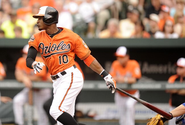 BALTIMORE, MD - MAY 26:  Adam Jones #10 of the Baltimore Orioles hits a triple in the third inning to extend hit hitting streak to seventeen games during a baseball game against the Kansas City Royals at Oriole Park at Camden Yards on May 26, 2012 in Baltimore, Maryland.   (Photo by Mitchell Layton/Getty Images)
