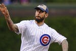 CHICAGO, IL - MAY 08: WWE Champion CM Punk throws out the first pitch before the Chicago Cubs versus the Atlanta Braves game on May 8, 2012 at Wrigley Field in Chicago, Illinois.  (Photo by David Banks/Getty Images)