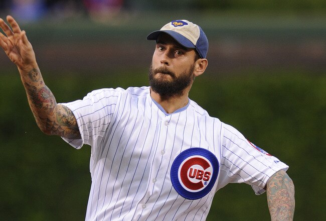 CHICAGO, IL - MAY 08: WWE Champion CM Punk throws out the first pitch before the Chicago Cubs versus the Atlanta Braves game on May 8, 2012 at Wrigley Field in Chicago, Illinois.  (Photo by David Banks/Getty Images)