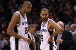 SAN ANTONIO, TX - MAY 27:  Tim Duncan #21 and Tony Parker #9 of the San Antonio Spurs talk on the court in the fourth quarter while taking on the Oklahoma City Thunder in Game One of the Western Conference Finals of the 2012 NBA Playoffs at AT&T Center on May 27, 2012 in San Antonio, Texas. NOTE TO USER: User expressly acknowledges and agrees that, by downloading and or using this photograph, user is consenting to the terms and conditions of the Getty Images License Agreement.  (Photo by Ronald Martinez/Getty Images)