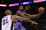 SAN ANTONIO, TX - MAY 27:  Kevin Durant #35 of the Oklahoma City Thunder goes up for a shot against Tim Duncan #21 of the San Antonio Spurs in the first quarter in Game One of the Western Conference Finals of the 2012 NBA Playoffs at AT&T Center on May 27, 2012 in San Antonio, Texas. NOTE TO USER: User expressly acknowledges and agrees that, by downloading and or using this photograph, user is consenting to the terms and conditions of the Getty Images License Agreement.  (Photo by Maxx Wolfson/Getty Images)