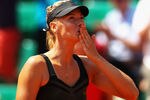 PARIS, FRANCE - MAY 29:  Maria Sharapova of Russia celebrates victory in her women's singles first round match against Alexandra Cadantu of Romania during day 3 of the French Open at Roland Garros on May 29, 2012 in Paris, France.  (Photo by Clive Brunskill/Getty Images)