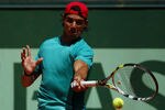 PARIS, FRANCE - MAY 26:  Rafael Nadal of Spain plys a forehand during a practice session ahead of the 2012 French Open at Roland Garros on May 26, 2012 in Paris, France.  (Photo by Dan Istitene/Getty Images)