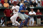 OMAHA, NE - JUNE 28:  Peter Mooney #6 of the South Carolina Gamecocks scores a run in front of Mike Zunino #3 of the Florida Gators during game 2 of the men's 2011 NCAA College Baseball World Series at TD Ameritrade Park Omaha on June 28, 2011 in Omaha, Nebraska.  (Photo by Ronald Martinez/Getty Images)