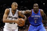 SAN ANTONIO, TX - MAY 27:  Tim Duncan #21 of the San Antonio Spurs drives to the basket against Kendrick Perkins #5 of the Oklahoma City Thunder in the first quarter in Game One of the Western Conference Finals of the 2012 NBA Playoffs at AT&T Center on May 27, 2012 in San Antonio, Texas. NOTE TO USER: User expressly acknowledges and agrees that, by downloading and or using this photograph, user is consenting to the terms and conditions of the Getty Images License Agreement.  (Photo by Tom Pennington/Getty Images)