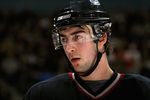VANCOUVER, CANADA - OCTOBER 31:  Luc Bourdon #4 of the Vancouver Canucks looks on during a break in game action against the Nashville Predators at General Motors Place on October 31, 2006 in Vancouver, British Columbia, Canada. The Predators defeated the Canucks 3-2.  (Photo by Jeff Vinnick/Getty Images)