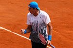 PARIS, FRANCE - MAY 24:  John Isner of USA celebrates a point during the men's singles round one match between Rafael Nadal of Spain and John Isner of USA on day three of the French Open at Roland Garros on May 24, 2011 in Paris, France.  (Photo by Matthew Stockman/Getty Images)