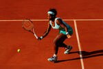 PARIS, FRANCE - MAY 29:  Serena Williams of USA plays a forehand in her women's singles first round match between Serena Williams of USA and Virginie Razzano of France during day three of the French Open at Roland Garros on May 29, 2012 in Paris, France.  (Photo by Mike Hewitt/Getty Images)