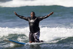 NORTH SHORE, HI - JANUARY 28:   Seven-Time Pro Bowler Warren Sapp catches a wave with the Bud Light Lime surf team on Oahu's North Shore, January 28, 2012 in Haleiwa, Hawaii.  (Photo by Marco Garcia/Getty Images for Bud Light Lime)