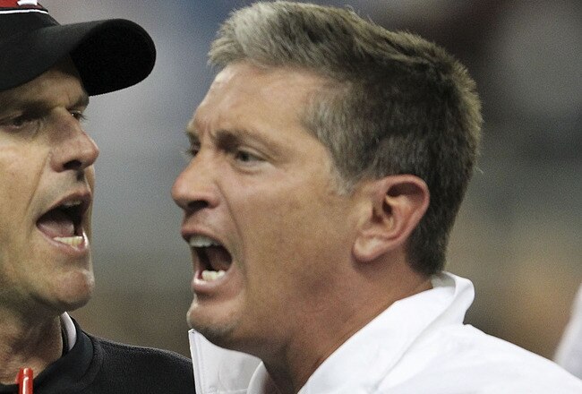 DETROIT - OCTOBER 16:  Jim Harbaugh head coach of the San Francisco 49ers argues with Jim Schwartz of the Detroit Lions during the NFL game at Ford Field on October 16, 2011 in Detroit, Michigan. The 49ers defeated the Lions 25-19.  (Photo by Leon Halip/Getty Images)
