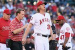 ANAHEIM, CA - MAY 28:  Starting pitcher Jered Weaver #36 of the Los Angeles Angels of Anaheim is attended to after injuring himself, as manager Mike Scioscia (L) and Howard Kendrick (R) #47 look on in the first inning against the New York Yankees at Angel Stadium of Anaheim on May 28, 2012 in Anaheim, California.  (Photo by Jeff Gross/Getty Images)