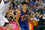 PHILADELPHIA, PA - MARCH 21: Jeremy Lin #17 of the New York Knicks drives around Spencer Hawes #00 of the Philadelphia 76ers at the Wells Fargo Center on March 21, 2012 in Philadelphia, Pennsylvania. NOTE TO USER: User expressly acknowledges and agrees that, by downloading and or using this photograph, User is consenting to the terms and conditions of the Getty Images License Agreement. (Photo by Drew Hallowell/Getty Images)