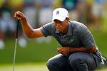 PONTE VEDRA BEACH, FL - MAY 10:  Tiger Woods of the United States lines up a putt on the 13th hole during the first round of THE PLAYERS Championship held at THE PLAYERS Stadium course at TPC Sawgrass on May 10, 2012 in Ponte Vedra Beach, Florida.  (Photo by Mike Ehrmann/Getty Images)