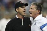 DETROIT - OCTOBER 16:  Jim Harbaugh head coach of the San Francisco 49ers argues with Jim Schwartz of the Detroit Lions during the NFL game at Ford Field on October 16, 2011 in Detroit, Michigan. The 49ers defeated the Lions 25-19.  (Photo by Leon Halip/Getty Images)