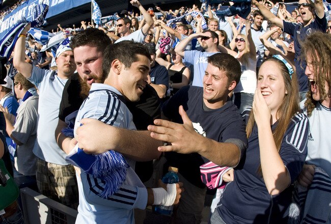 KANSAS CITY, KS - OCTOBER 15: Soony Saad #11 of Sporting Kansas City celebrates with fans a 2-0 win over New York Red Bulls at Livestrong Sporting Park on October 15, 2011 in Kansas City, Kansas. (Photo by Ed Zurga/Getty Images)