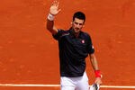 PARIS, FRANCE - MAY 30:  Novak Djokovic of Serbia waves to the crowd as he celebrates match point after his men's singles second round match against Blaz Kavcic of Slovenia during day 4 of the French Open at Roland Garros on May 30, 2012 in Paris, France.  (Photo by Mike Hewitt/Getty Images)