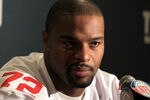 INDIANAPOLIS, IN - FEBRUARY 02:  Osi Umenyiora #72 of the New York Giants answers questions from the press during a media availability session for Super Bowl XLVI at the Indianapolis Downtown Marriott on February 2, 2012 in Indianapolis, Indiana.  (Photo by Scott Halleran/Getty Images)