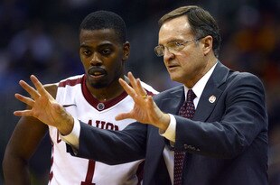KANSAS CITY, MO - MARCH 07:   Sam Grooms #1 of the Oklahoma Sooners listens to Lon Kruger head coach of Oklahoma Sooners during the first round of the Big 12 Basketball Tournament March 07, 2011 at Sprint Center in Kansas City, Missouri. (Photo by Ed Zurga/Getty Images)