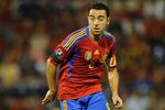 ALICANTE, SPAIN - OCTOBER 11: Xavi Hernandez of Spain runs with the ball during the UEFA EURO 2012 Group I Qualifier between Spain and Scotland at the Rico Perez stadium on October 11, 2011 in Alicante, Spain.  (Photo by Jasper Juinen/Getty Images)