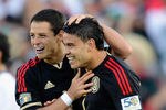PASADENA, CA - JUNE 25:  Pablo Barrera #7 of Mexico celebrates his goal with Javier 'Chicharito' Hernandez #14 against the United States during the 2011 CONCACAF Gold Cup Championship at the Rose Bowl on June 25, 2011 in Pasadena, California.  (Photo by Kevork Djansezian/Getty Images)