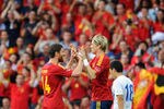 BERN, SWITZERLAND - MAY 30: Fernando Torres (2nd R) of Spain celebrates scoring with his teammate Xabi Alonso (3rd R) and Santi Cazorla (3rd L), Benat Etxebarria (2nd L) and Raul Albiol (L) as Tae Hee Nam (R) of Korea Republic trudges past during the international friendly match between Spain and Korea Republic on May 30, 2012 in Bern, Switzerland.  (Photo by Jasper Juinen/Getty Images)