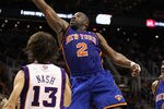PHOENIX - JANUARY 07:  Raymond Felton #2 of the New York Knicks lays up a shot over Steve Nash #13 of the Phoenix Suns during the NBA game at US Airways Center on January 7, 2011 in Phoenix, Arizona.   The Knicks defeated the Suns 121-96.  NOTE TO USER: User expressly acknowledges and agrees that, by downloading and or using this photograph, User is consenting to the terms and conditions of the Getty Images License Agreement.  (Photo by Christian Petersen/Getty Images)