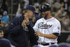 SAN DIEGO, CA - MAY 8:  Yonder Alonso #23 of the San Diego Padres is congratulated by manager Bud Black #20 after scoring during the eighth inning of a baseball game against the Colorado Rockies at Petco Park on May 8, 2012 in San Diego, California.  (Photo by Denis Poroy/Getty Images)