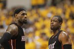 INDIANAPOLIS, IN - MAY 24:  LeBron James #6 and  Dwyane Wade #3 of the Miami Heat wait during a time-out against the Indiana Pacers in Game Six of the Eastern Conference Semifinals in the 2012 NBA Playoffs at Bankers Life Fieldhouse on May 24, 2012 in Indianapolis, Indiana. The Heat defeated the Pacers 105-93 to win the series. NOTE TO USER: User expressly acknowledges and agrees that, by downloading and/or using this photograph, User is consenting to the terms and conditions of the Getty Images License Agreement.  (Photo by Jonathan Daniel/Getty Images)