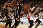 MIAMI, FL - MAY 13:  Forward Chris Bosh #1 of the Miami Heat looks to pass against Center Roy Hibbert #55 (R) of the Indiana Pacers in Game One of the Eastern Conference Semifinals in the 2012 NBA Playoffs on May 13, 2012 at the American Airines Arena in Miami, Florida.  The Heat defeated the Pacers 95-86. NOTE TO USER: User expressly acknowledges and agrees that, by downloading and or using this photograph, User is consenting to the terms and conditions of the Getty Images License Agreement.  (Photo by Marc Serota/Getty Images)
