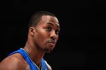 NEW YORK, NY - MARCH 28: Dwight Howard #12 of the Orlando Magic looks on against the New York Knicks at Madison Square Garden on March 28, 2012 in New York City. NOTE TO USER: User expressly acknowledges and agrees that, by downloading and/or using this Photograph, user is consenting to the terms and conditions of the Getty Images License Agreement.  (Photo by Chris Trotman/Getty Images)