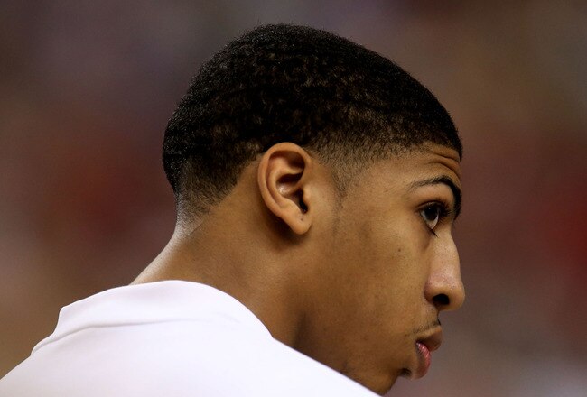 NEW ORLEANS, LA - MARCH 31:  Anthony Davis #23 of the Kentucky Wildcats looks on during the national anthem before the Wildcats take on the Louisville Cardinals during the National Semifinal game of the 2012 NCAA Division I Men's Basketball Championship at the Mercedes-Benz Superdome on March 31, 2012 in New Orleans, Louisiana.  (Photo by Ronald Martinez/Getty Images)