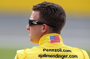 CHARLOTTE, NC - MAY 18:  AJ Allmendinger, driver of the #22 Pennzoil Dodge, stands on the grid during qualifying for the NASCAR Sprint Showdown at Charlotte Motor Speedway on May 18, 2012 in Charlotte, North Carolina.  (Photo by Scott Halleran/Getty Images for NASCAR)