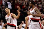 PORTLAND, OR - APRIL 23:  Brandon Roy #7 high fives LaMarcus Aldridge #12 of the Portland Trail Blazers against the Dallas Mavericks in Game Four of the Western Conference Quarterfinals in the 2011 NBA Playoffs on April 23, 2011 at the Rose Garden in Portland, Oregon. NOTE TO USER: User expressly acknowledges and agrees that, by downloading and or using this photograph, User is consenting to the terms and conditions of the Getty Images License Agreement.  (Photo by Jonathan Ferrey/Getty Images)