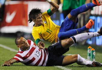 LANDOVER, MD - MAY 30: Neymar #11 of Brazil and Jermaine Jones #13 of USA collide going after the ball during an International friendly game at FedExField on May 30, 2012 in Landover, Maryland.  (Photo by Rob Carr/Getty Images)
