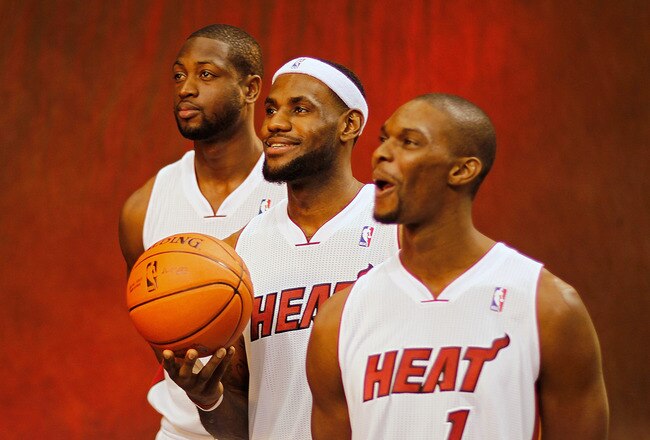 MIAMI, FL - DECEMBER 12:  Dwyane Wade #3, LeBron James #6, and Chris Bosh #1 of the Miami Heat poses during media day at American Airlines Arena on December 12, 2011 in Miami, Florida.  (Photo by Mike Ehrmann/Getty Images)
