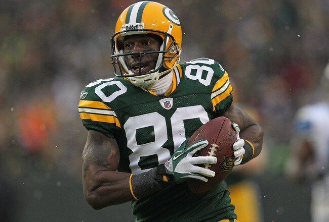 GREEN BAY, WI - JANUARY 01:  Donald Driver #80 of the Green Bay Packers reacts as he scores a touchdown against the Detroit Lions at Lambeau Field on January 1, 2012 in Green Bay, Wisconsin. The Packers defeated the Lions 45-41.  (Photo by Jonathan Daniel/Getty Images)