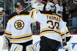 NEWARK, NJ - OCTOBER 16: Tim Thomas #30 of the Boston Bruins is congratulated by Tuukka Rask #40 of the Boston Bruins after the Boston Bruins defeated the New Jersey Devils 4-1 at the Prudential Center on October 16, 2010 in Newark, New Jersey. (Photo by Christopher Pasatieri/Getty Images)