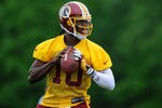 ASHBURN, VA - MAY 06: Robert Griffin III #10 of the Washington Redskins drops back during the Washington Redskins rookie minicamp on May 6, 2012 in Ashburn, Virginia. (Photo by Patrick McDermott/Getty Images)
