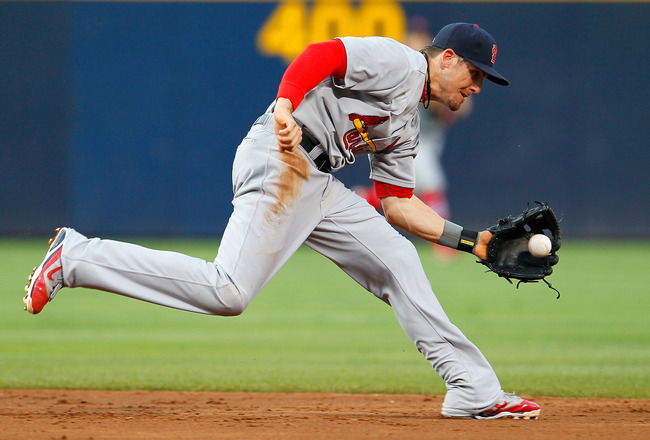 ATLANTA, GA - MAY 29: Tyler Greene #27 of the St. Louis Cardinals scoops up a ground ball hit by Martin Prado #14 of the Atlanta Braves in the third inning at Turner Field on May 29, 2012 in Atlanta, Georgia. (Photo by Kevin C. Cox/Getty Images)