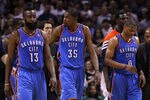 SAN ANTONIO, TX - MAY 27:  (L-R) James Harden #13, Kevin Durant #35 and Russell Westbrook #0 of the Oklahoma City Thunder walk off the court after losing 101-98 to the San Antonio Spurs in Game One of the Western Conference Finals of the 2012 NBA Playoffs at AT&T Center on May 27, 2012 in San Antonio, Texas. NOTE TO USER: User expressly acknowledges and agrees that, by downloading and or using this photograph, user is consenting to the terms and conditions of the Getty Images License Agreement.  (Photo by Ronald Martinez/Getty Images)